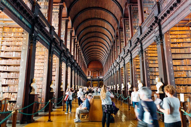Students walking through a historic university library